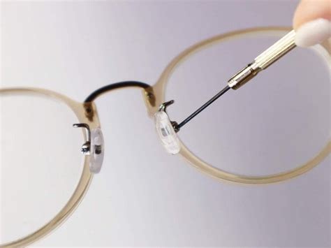 fixing nose piece on glasses